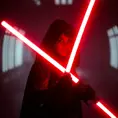 Portrait of a silhouette star wars figure in her red lightsaber, in the style of evocative environmental portraits, dark, red