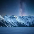A snow-covered mountain range under a clear, starry night sky, with the Milky Way visible in the background and a frozen lake reflecting the celestial beauty.